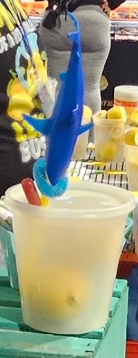 Lemonade topped with a blue shark garnish
